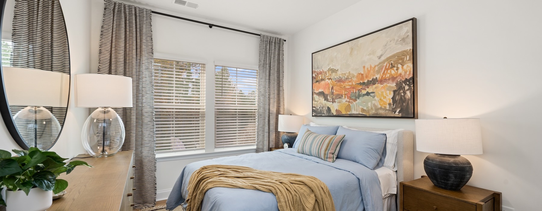 a bedroom with a bed and a dresser