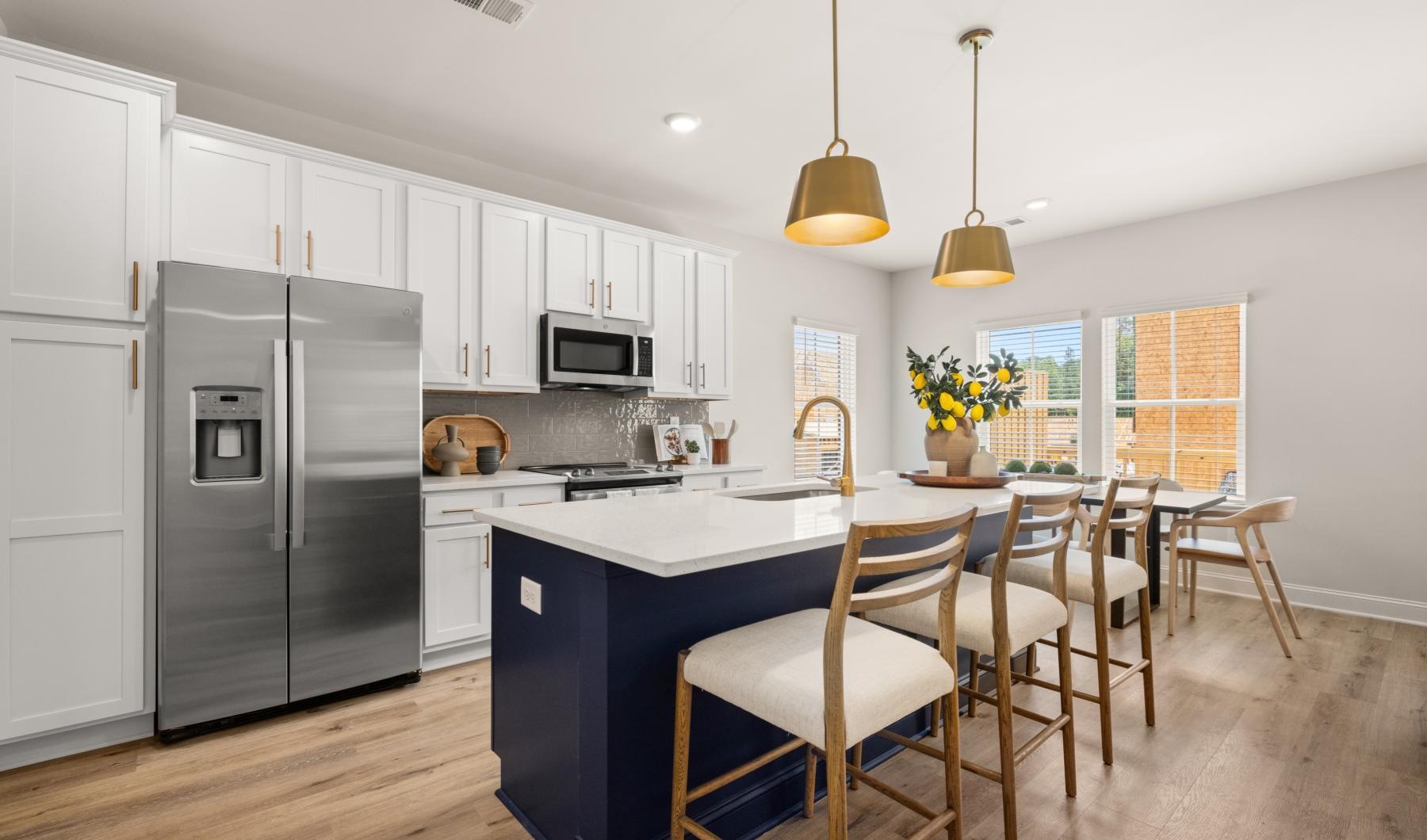a kitchen with white cabinets