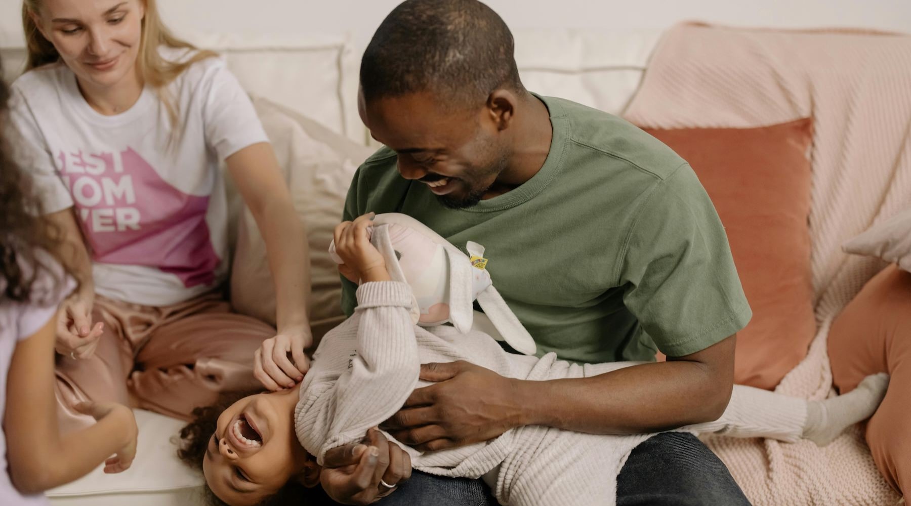 a family playing together on a couch