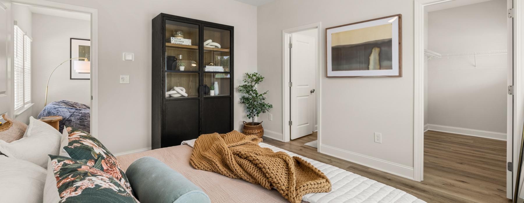 a living room with a couch and a book shelf