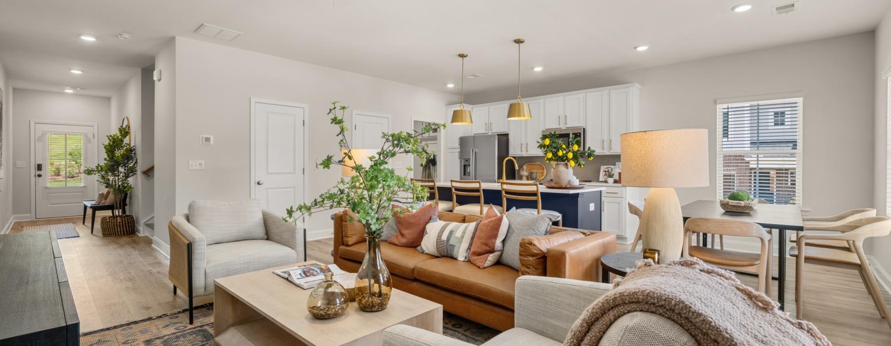 a living room with a couch and chairs