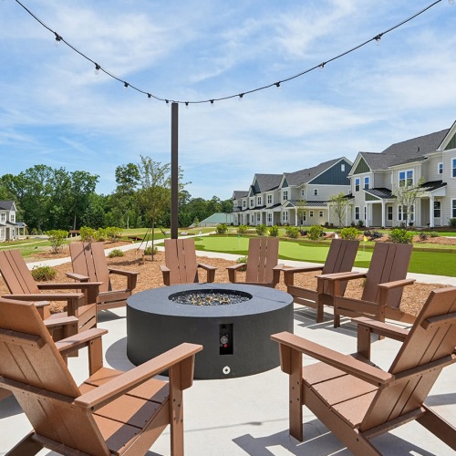 courtyard fire pit surrounded by lawn chairs
